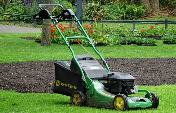 Green rolling lawnmower